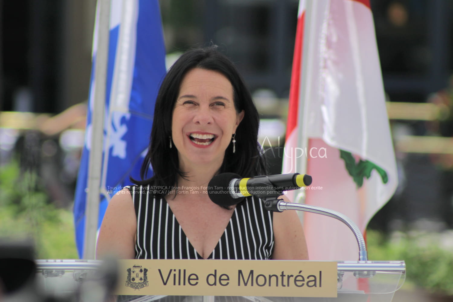 Portrait of Montreal mayoress Valérie Plante ("Projet Montréal" party) candidly smiling and laughing before giving a speech